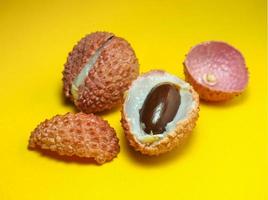 sliced lychee. Round pimply fruits. Chinese plum. fruit peel. photo