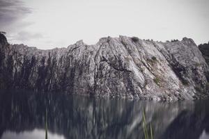 The limestone mountains after the concession explosion during the rainy season form a large and beautiful pond. photo