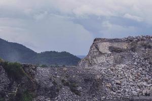 The limestone mountains after the concession explosion during the rainy season form a large and beautiful pond. photo