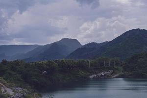 The limestone mountains after the concession explosion during the rainy season form a large and beautiful pond. photo