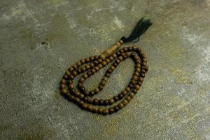 wooden tasbih beads isolated. islamic prayer beads photo