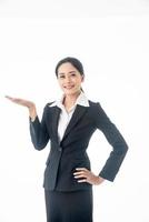 Asian beautiful smart  and young businesswoman with black long hair and suit  is the executive or manager show her hand and smiling with confidence  in successful on isolated white background photo