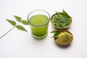 Neem Powder, paste and juice. Azadirachta indica or commonly known as nimtree or Indian lilac photo