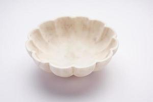 Empty white bowl made up of white marble or stone photo