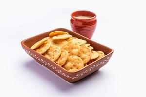 Mathri or mathari is a Rajasthani, Indian snack and a type of flaky biscuit, tea time snack photo