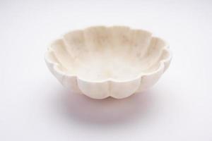 Empty white bowl made up of white marble or stone photo