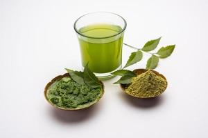 Neem Powder, paste and juice. Azadirachta indica or commonly known as nimtree or Indian lilac photo