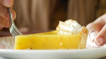 Close up of lemon tart pie slice with meringue topping video