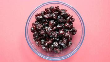 Overhead panning view of a bowl full of dried cranberries video