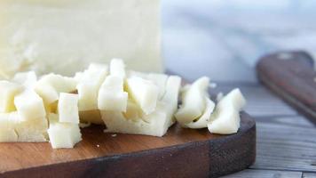 Macro shot of cut cheese in small pieces video