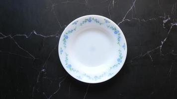 Piling up delicate porcelain plates video