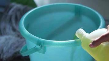 Green soap dilluted in a bucket video