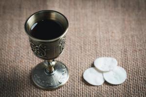 Concept of Eucharist or holy communion of Christianity. Eucharist is sacrament instituted by Jesus. during last supper with disciples. Bread and wine is body and blood of Jesus Christ of Christians. photo