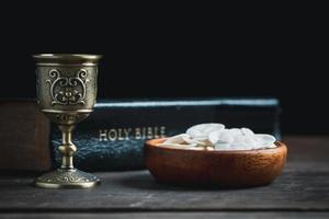 Concept of Eucharist or holy communion of Christianity. Eucharist is sacrament instituted by Jesus. during last supper with disciples. Bread and wine is body and blood of Jesus Christ of Christians. photo