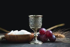 Concept of Eucharist or holy communion of Christianity. Eucharist is sacrament instituted by Jesus. during last supper with disciples. Bread and wine is body and blood of Jesus Christ of Christians. photo