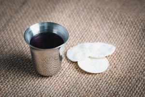 Concept of Eucharist or holy communion of Christianity. Eucharist is sacrament instituted by Jesus. during last supper with disciples. Bread and wine is body and blood of Jesus Christ of Christians. photo