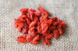 goji berry dry spices and herbs dood ingredients - goji berries on the sack photo