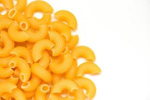 macaroni top view on white background close up raw macaroni uncooked delicious pasta or penne noodles photo