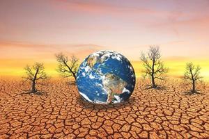 changing the environment globe on a barren land photo