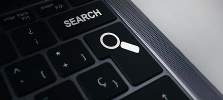 Banner of keyboard with search button. Concept of searching browsing Internet data information. photo