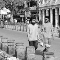 Old Delhi, India, April 15, 2022 - Unidentified group of men walking the streets of Old Delhi, Street Photography of Chandni Chowk market of Old Delhi during morning time, Old Delhi Street Photography photo