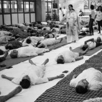 Delhi, India, June 19 2022-Group Yoga exercise session for people of different age groups in Balaji Temple,Vivek Vihar, International Yoga Day, Big group of adults attending yoga class-Black and White photo