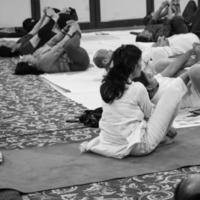 Delhi, India, June 19 2022-Group Yoga exercise session for people of different age groups in Balaji Temple,Vivek Vihar, International Yoga Day, Big group of adults attending yoga class-Black and White photo