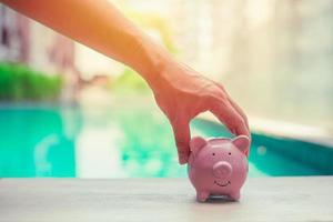 Pig Bank, Hand Holding, Personal finance money saving concept photo