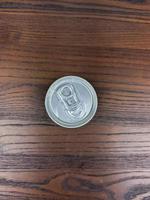close up cans of cold energy drinks on a wooden table photo