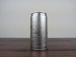 close up cans of cold energy drinks on a wooden table photo