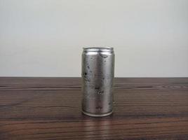 close up cans of cold energy drinks on a wooden table photo