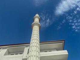 Large beautiful high muslim mosque islamic temple for prayers to god allah with high religion towers in warm tropical eastern country southern resort photo