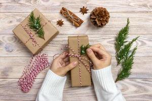 Gift wrapping. Woman packs gifts step by step photo