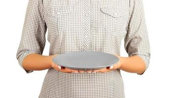 girl is holding an empty gray matte plate. Isolated on white background Template for your design. perspective view photo