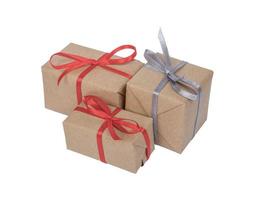 Holiday gift boxes decorated with ribbon isolated on white background photo