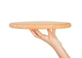 hand holding Empty wooden plate isolated on white background. perspective view, isolated on white background photo