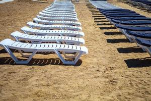 Row of beach beds on an empty beach selective focus. photo