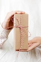 Celebrate year 2018. Woman hand holding gift box for Christmas and Happy new year 2018 background photo