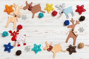 Top view of Christmas decorations and toys on wooden background. Copy space. Empty place for your design. New Year concept photo