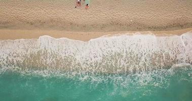 Aerial view of the amazing idyllic beach with waved sea. video