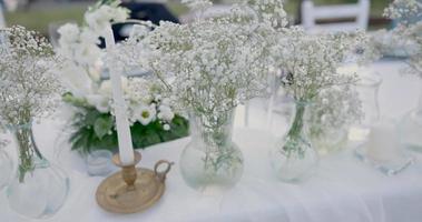 Wedding table decoration with flowers. video