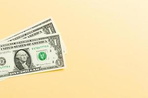 Stack of 1 dollar banknotes on colorful background. Top view of financial concept with empty space for your design photo