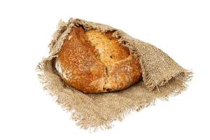 freshly baked bread on cloth isolated on white background photo