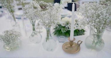 Wedding table decoration with flowers. video