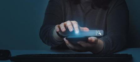 Woman using smartphone with VR search bar. SEO. Browser technology. Concept of searching on internet with copy space. photo