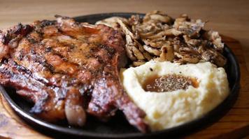 A dinner plate, mashed potatos, grilled meat and mushrooms video