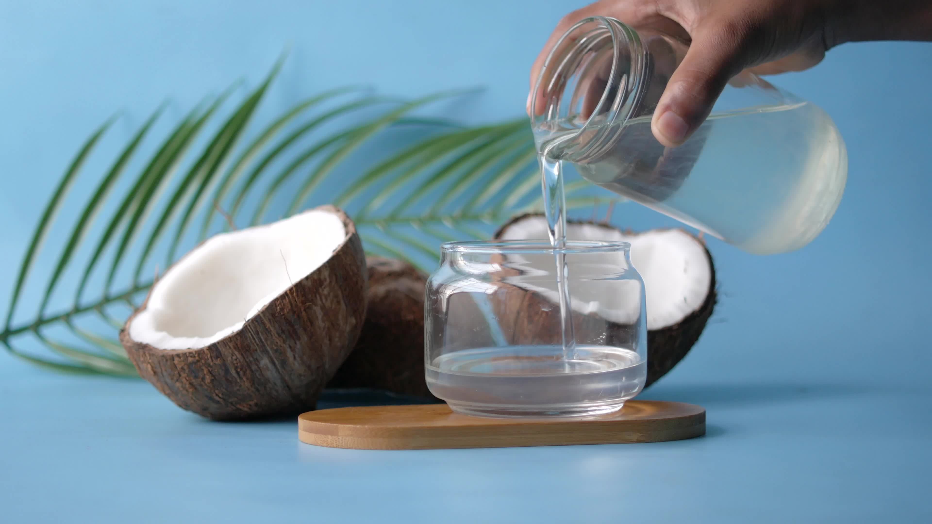 Fresh coconut water poured into a glass 13782503 Stock Video at Vecteezy