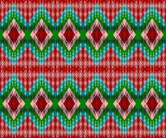 red and green seamless geometric ethnic pattern background vector