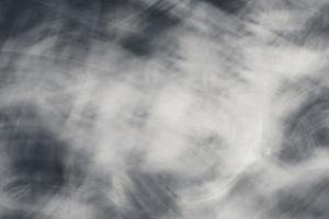 Abstract horizontal dark background with worn gaps and waves. photo