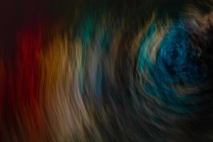 Multicolored dark abstract background with swirls. photo